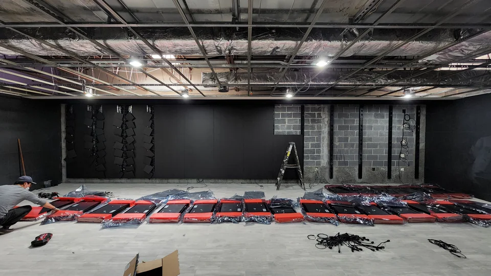 Display assembly underway with panels and cabling visible.