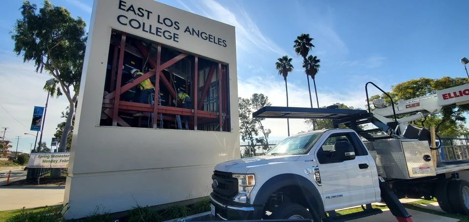 Work underway inside a campus monument sign.