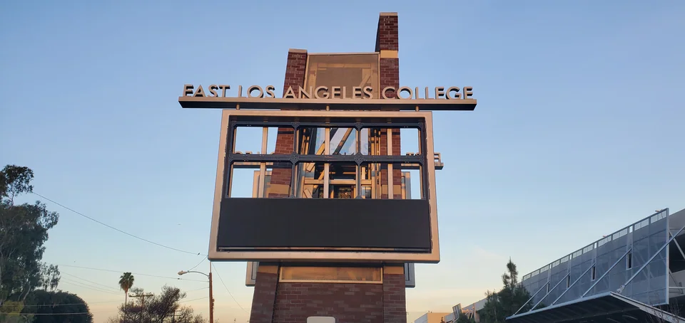 Partially exposed display frame beneath the college lettering.