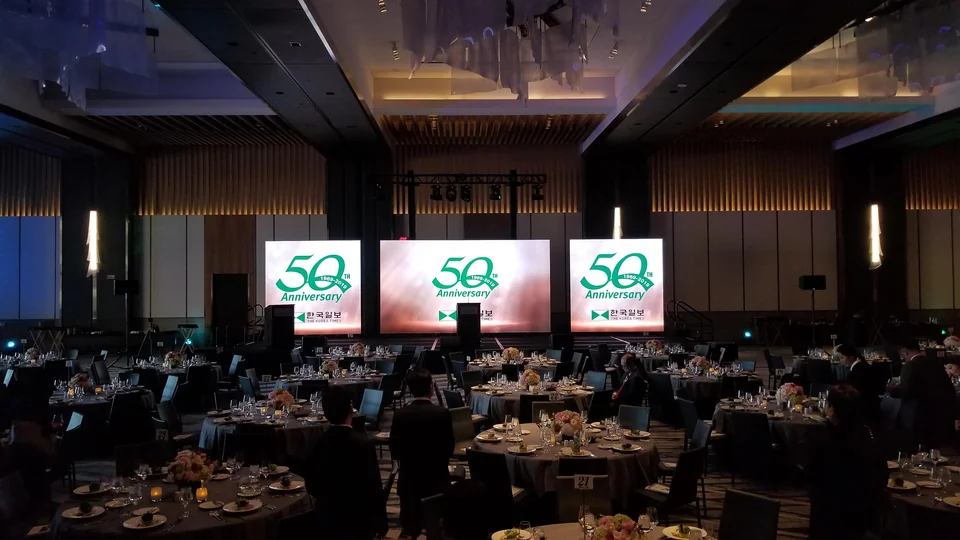 The three-display arrangement within the ballroom.
