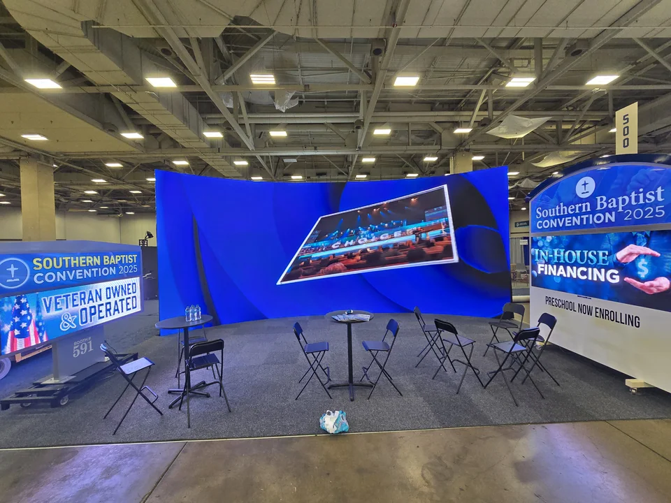 Promotional content across the curved display.