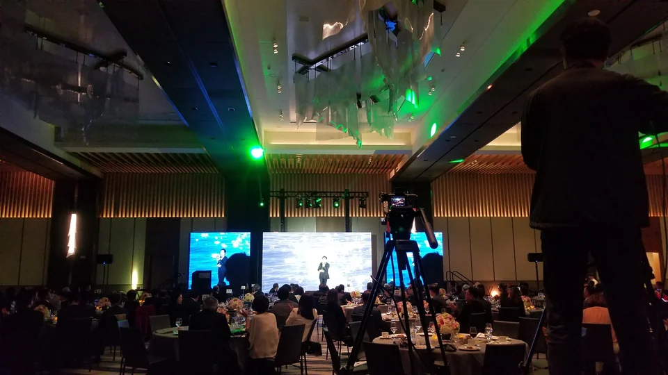 A camera position overlooking the ballroom presentation.