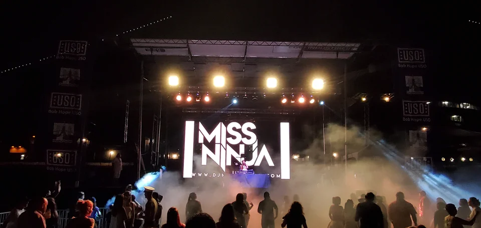 Evening performance visuals on the outdoor LED backdrop.