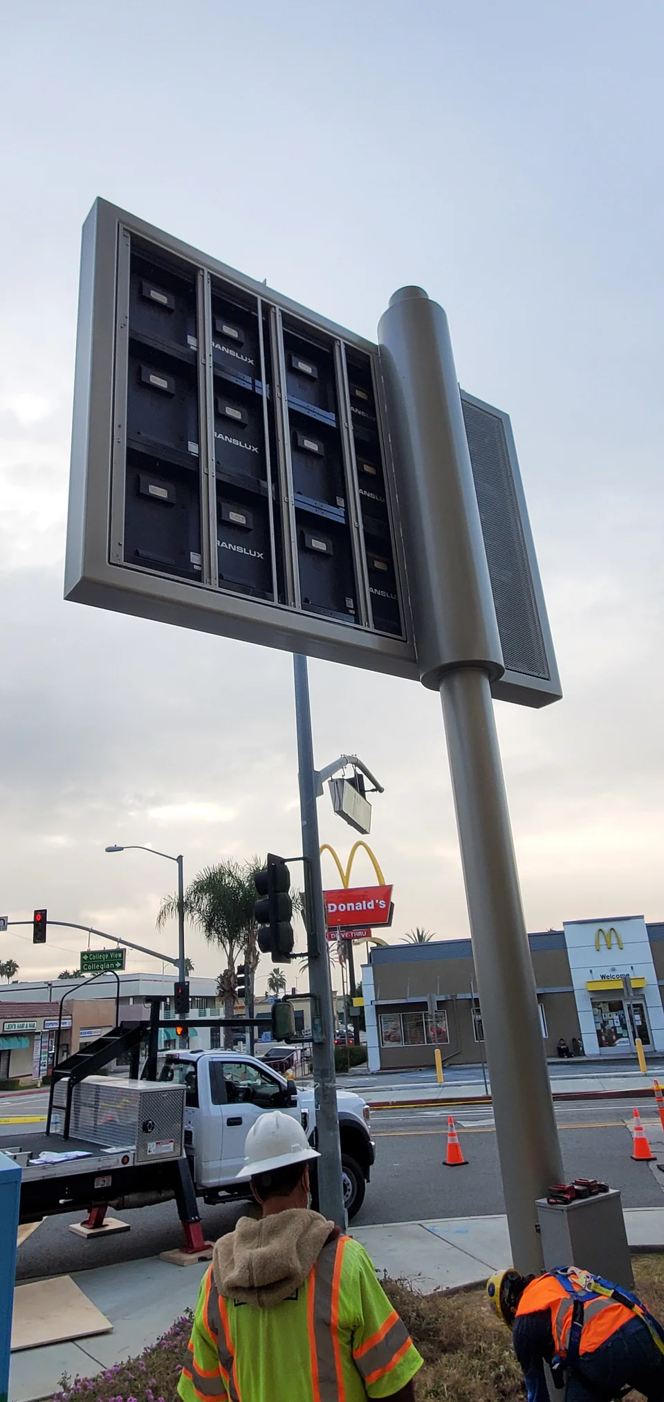 Rear view of the pole-mounted display cabinets during site work.