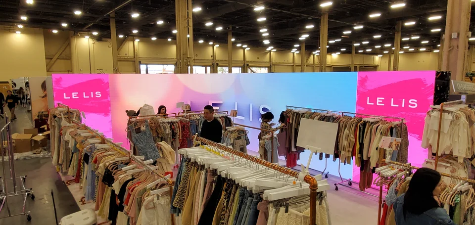 Digital backdrops surrounding the merchandise area.